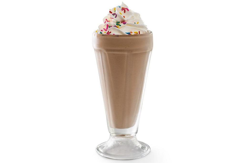 Chocolate Milkshake · Creamy soft-serve blended with milk and chocolate syrup. Garnished with whipped cream and rainbow sprinkles.