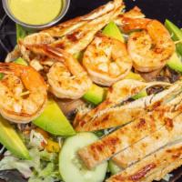Agave Salad · Gluten-free. Grilled chicken breasts, shrimp and mushrooms over a bed of lettuce, topped wit...