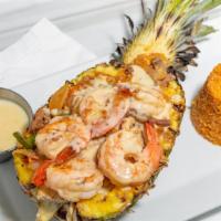 Pina Loca · Gluten-free. Grilled pineapple stuffed with chicken, steak, pineapple chunks, peppers and on...