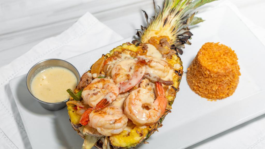 Pina Loca · Gluten-free. Grilled pineapple stuffed with chicken, steak, pineapple chunks, peppers and onions in
a molcajete sauce, topped with cheese sauce, served with rice or beans and tortillas.