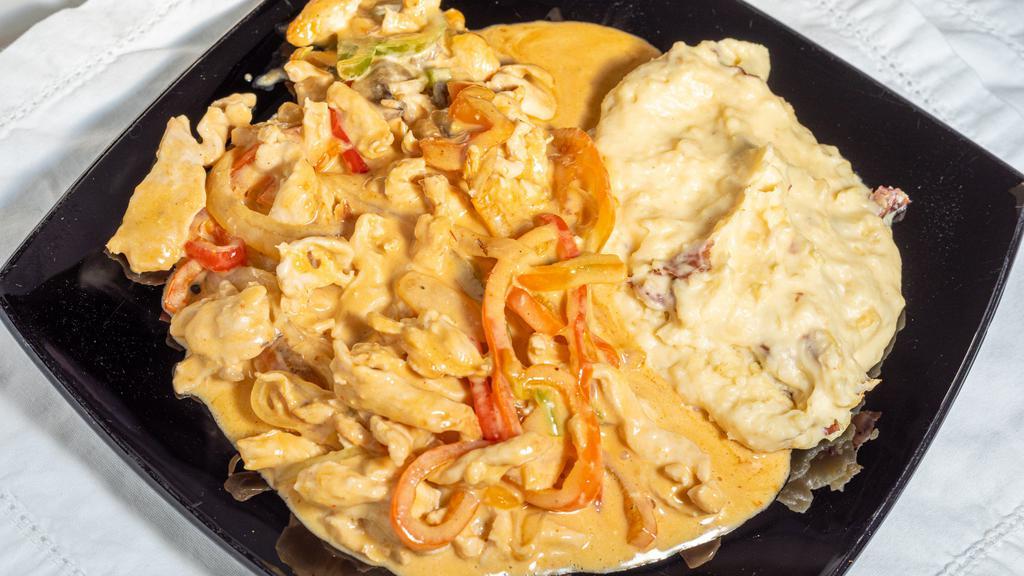 Pollo Azteca · Gluten-free. Chicken breast with sautéed peppers, onion and mushrooms in a creamy chipotle sauce, served with our seasoned mashed potatoes.