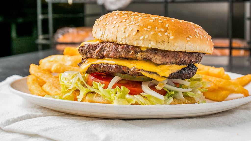 Double Burger · American Cheese, Lettuce, tomatoes, onions, pickles, mustard, mayo and ketchup..