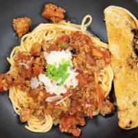 Pasta Bolognese · Prime Chuck and Pork, Organic Fire Roasted Tomatoes, Red Wine, Parmesan Cheese, Pasta, Crost...