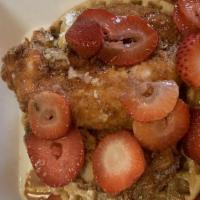 Cookie Butter Chicken & Waffles · Waffle topped with cookie butter spread, three chicken strips, strawberries, and whipped cre...