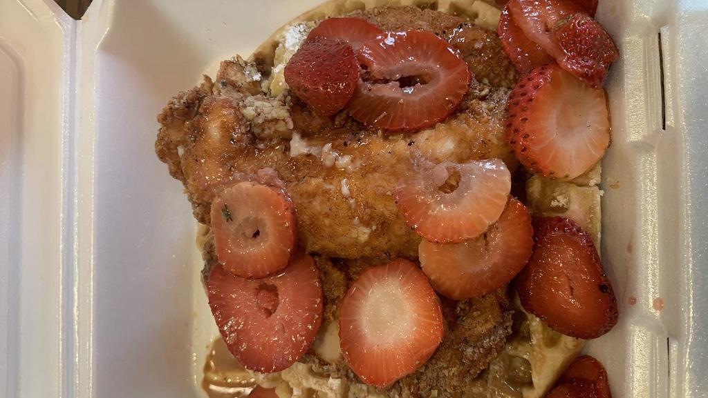 Cookie Butter Chicken & Waffles · Waffle topped with cookie butter spread, three chicken strips, strawberries, and whipped cream.