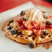 Cookie Butter Waffle · Waffle topped with your choice of two fruits and whipped cream.