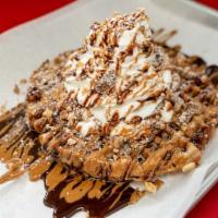 Reese'S Waffle · Waffle with Reese's, topped with whipped cream, and drizzled with cookie butter and Nutella.