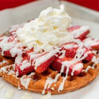Strawberry Waffle · Strawberry flavored waffle, topped with strawberries, whipped cream, and powdered sugar.