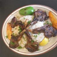 Lamb Chops · Very tender meat marinated and char-broiled.