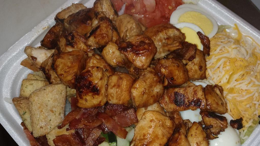 The Big Stuffed Salad · Mixed greens with tomatoes, cucumbers, onions, cheese, eggs, croutons and banana peppers topped with choice of grilled chicken, steak, grilled shrimp,teriyaki chicken  served with dressing and texas toast