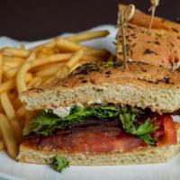 Blt · Brown sugar peppered bacon, balsamic glazed tomato, mixed greens, and feta cheese on grilled...