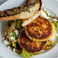 Crab Cake Salad · Lump crab cakes served on mixed greens with tomato, red onion, penne pasta, cucumber, artich...