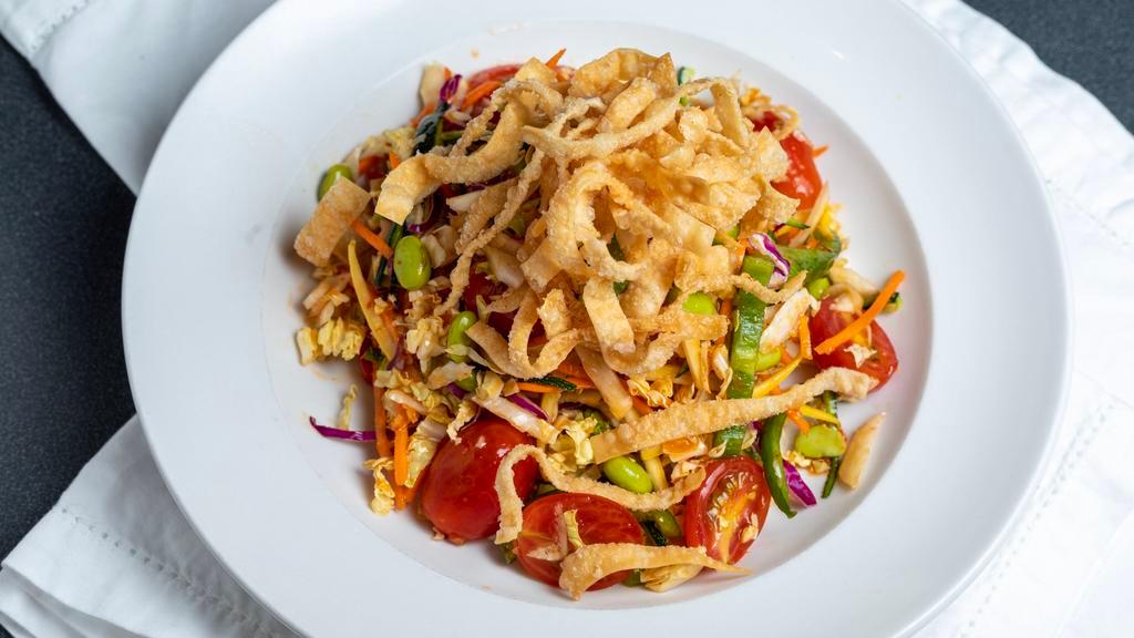 Thai Vegetable Salad · Fresh zucchini, yellow squash, bell pepper, tomato, fried wonton noodle, carrot, Napa cabbage, edamame, and peanuts with chili lime dressing. Add chicken, salmon or shrimp for an additional charge.