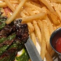 Steak Frites · Grilled flat iron steak with gremolata and parmesan fries.