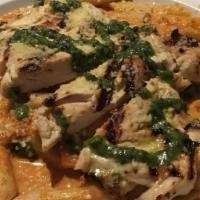 Pasta Penne · Served in a creamy vodka tomato sauce with artichokes and spinach. Topped with fresh grated ...