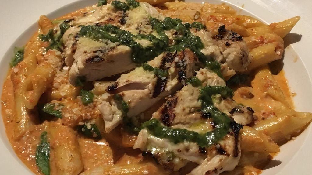 Pasta Penne · Served in a creamy vodka tomato sauce with artichokes and spinach. Topped with fresh grated Romano cheese and pesto. Add chicken, meatballs, salmon or shrimp for an additional charge.