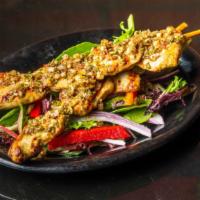 Chicken Skewers · Grilled chicken and topped with chimichurri sauce.