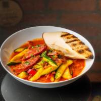 Cured Spanish Sausage · Sautéed with onions, zucchini, squash, red pepper, garlic tomato sauce & served with a grill...