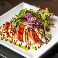 Capresse Salad  · Fresh Buffalo mozzarella, grilled tomatoes field greens & drizzled with balsamic glaze and b...