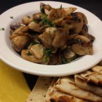Mushrooms And Garlic · Vegetarian. Gluten-Free. Sautéed mushrooms with sherry wine, fresh garlic and side of grille...