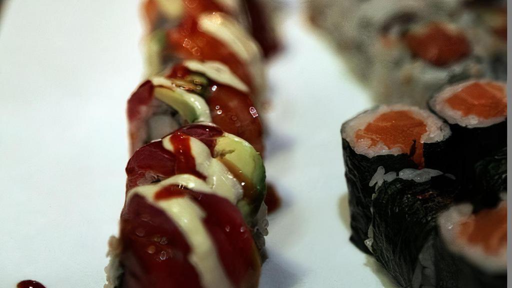 Ocean Roll · Shrimp, top with salmon, tuna, avocado, wasabi mayo, eel sauce, and hot sauce.