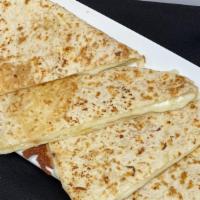 Quesadilla - Cheese  · Our special blend of cheese melted inside a fresh flour tortilla.  Add chicken for the ...