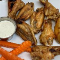Wings 8Pc · Choose from our boneless or traditional, bone-in chicken wings.  Served seasoned with dry ru...