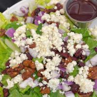 Cranberry Walnut · Chopped romaine, feta cheese, dried cranberries, red onion and candied walnuts. Served with ...