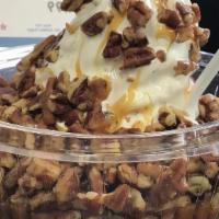 Turtle Overload · Chocolate flakes, hot caramel and pecan pieces blended with vanilla ice cream or custard.