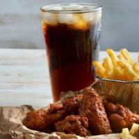 Famous 8-Piece Wing Combo  · 8 virgin wings tossed in sauce served with fries and a drink.