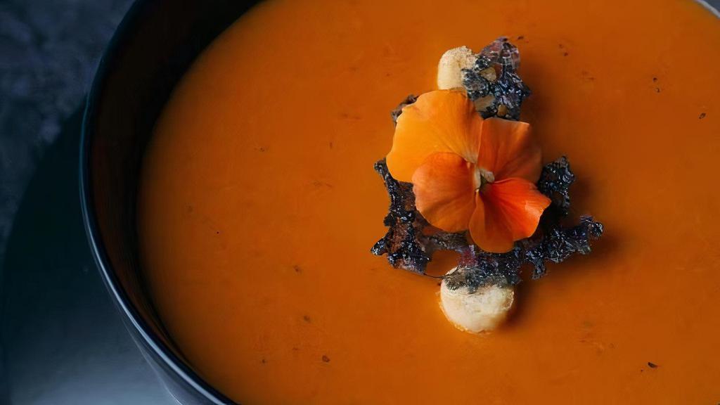 Tomato Soup · Touch of cream and slightly spiced.