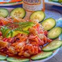 Tostada Camaron Cocido / Cooked Shrimp Tostada · Camarón cocido, pepino, cebolla, tomate, cilantro y salsa negra. / Cooked shrimp, cucumber, ...