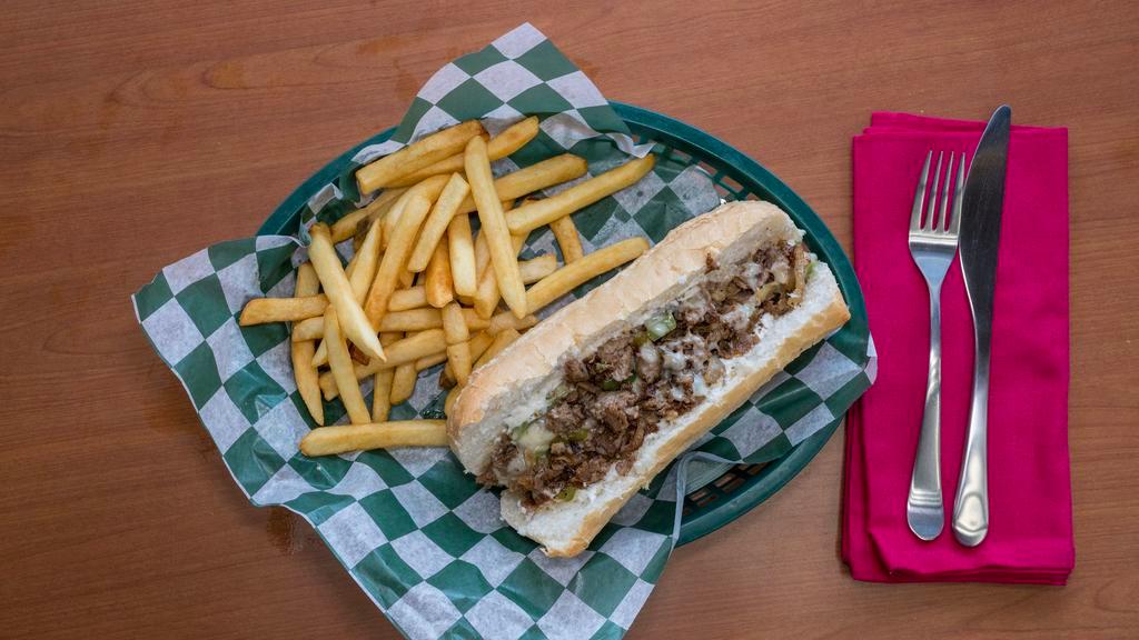 Philly Cheesesteak Sandwich · Generous slices of marinated beef grilled with fresh bell pepper, onion, mushrooms and topped with melted mozzarella and mayo on a hoagie bun.