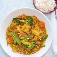 Chicken Coconut Curry · Garlic, onions, potatoes, carrots, broccoli, peapods, curry in coconut milk