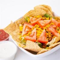Taco Salad · Lettuce, carrots, red cabbage, cheddar cheese, Mexican beef, tomatoes, tortilla chips. Serve...