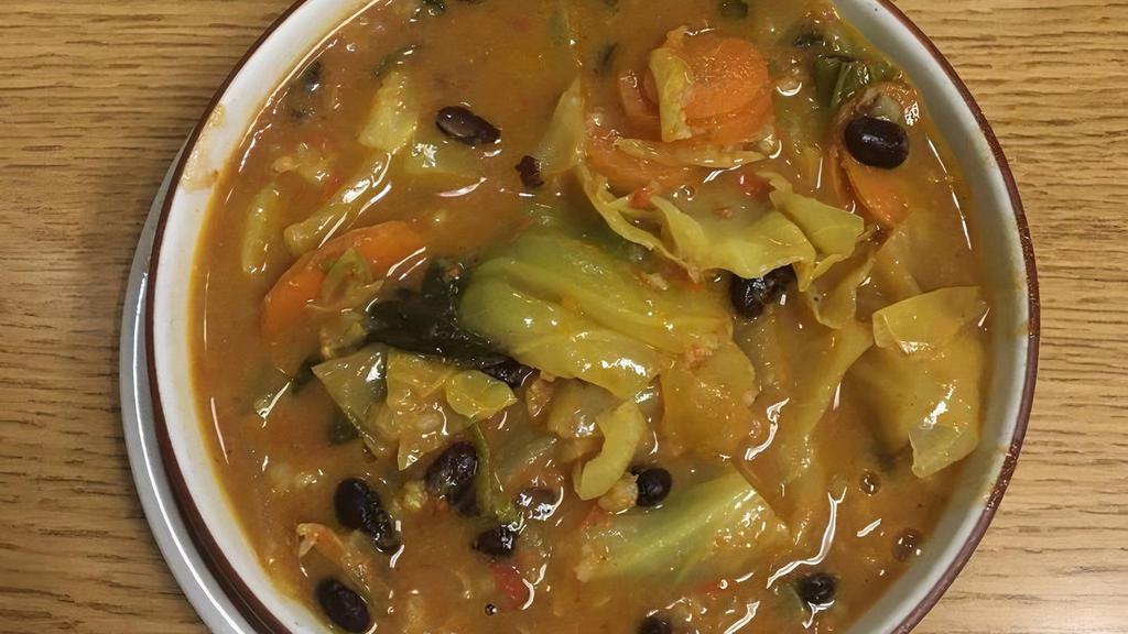Vegetable Curry Soup · A hearty soup of black beans, brown/wild rice blend, and veggies with fresh, delightful curry flavors and a hint of coconut.