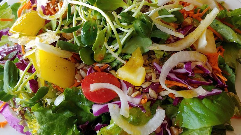 Garden Of Eden · Mixed greens, in-season veggies, sliced onion, sunflower seeds, walnuts, sesame seeds, raisins, and clover sprouts with your choice of dressing. CONTAINS nuts