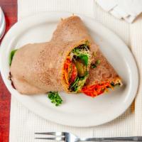 Mediterranean Wrap · Packed with roasted red pepper hummus, raw falafel, tomatoes, raw pickles, onions, shredded ...