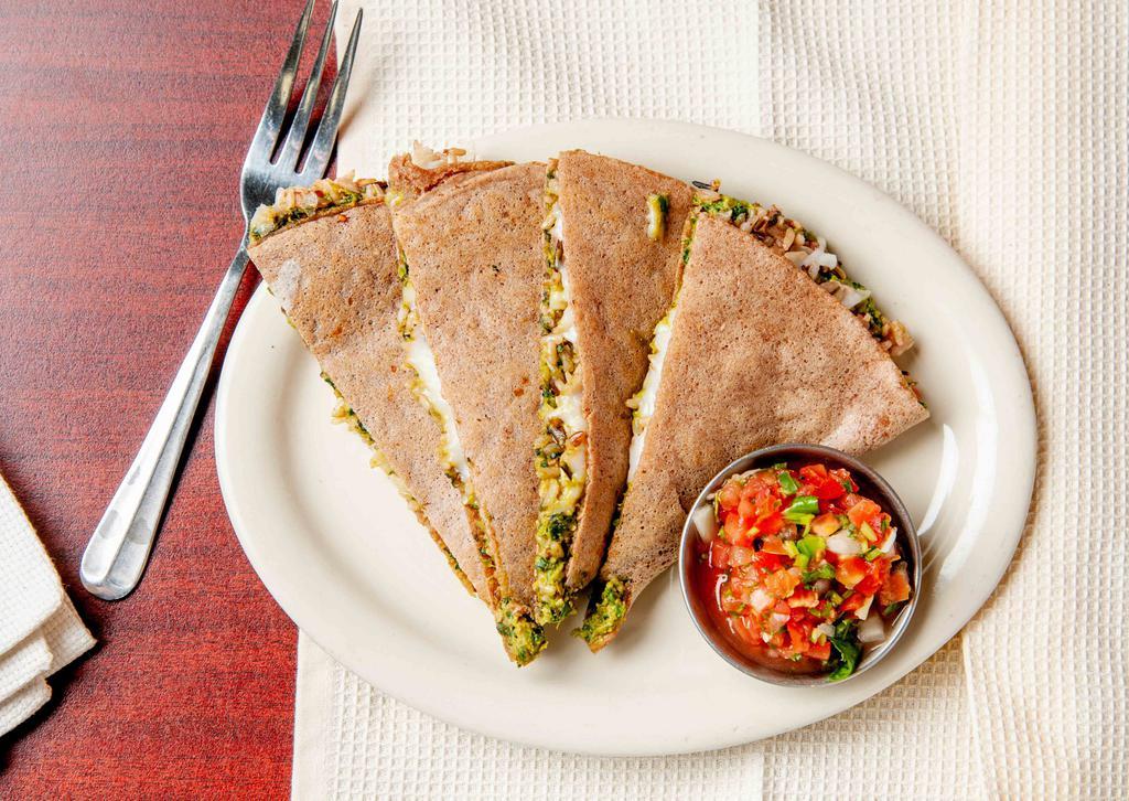 Spana-Rice Quesadilla · Our delicious spanako, wild/brown rice blend and daiya cheeze. CONTAINS nuts and soy