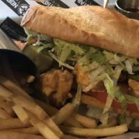 Spicy Fried Shrimp Po Boy · Shredded lettuce, tomatoes, fried shrimp, and cry baby aioli on French bread.