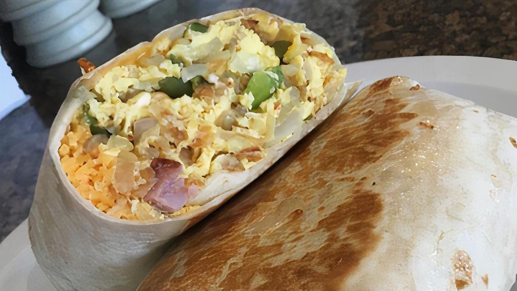 Breakfast Burrito · Your choice of ham, bacon or sausage with eggs, hash browns, green peppers, onion and cheddar cheese.
