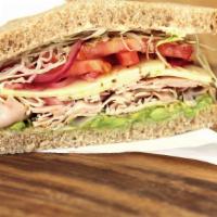 Baja Chipotle Turkey · Sliced turkey with southwest chipotle mayo, shaved cabbage, red onions, tomato, avocado, and...