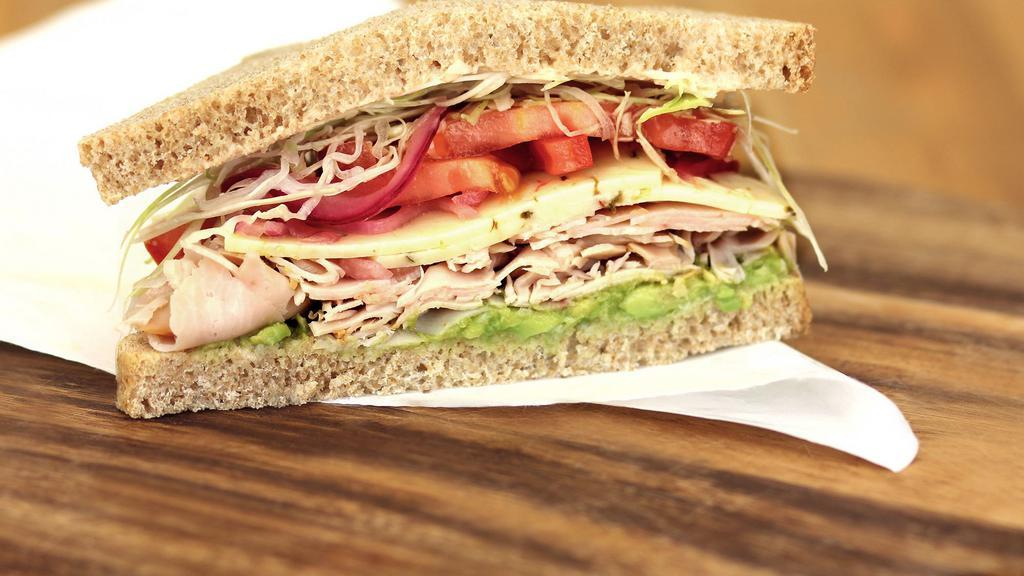 Baja Chipotle Turkey · Sliced turkey with southwest chipotle mayo, shaved cabbage, red onions, tomato, avocado, and pepper Jack cheese. Served on honey whole wheat. 620 calories.