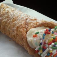 Cannoli · Italian pastry dipped in chocolate, sprinkles, and covered in powdered sugar (wow)