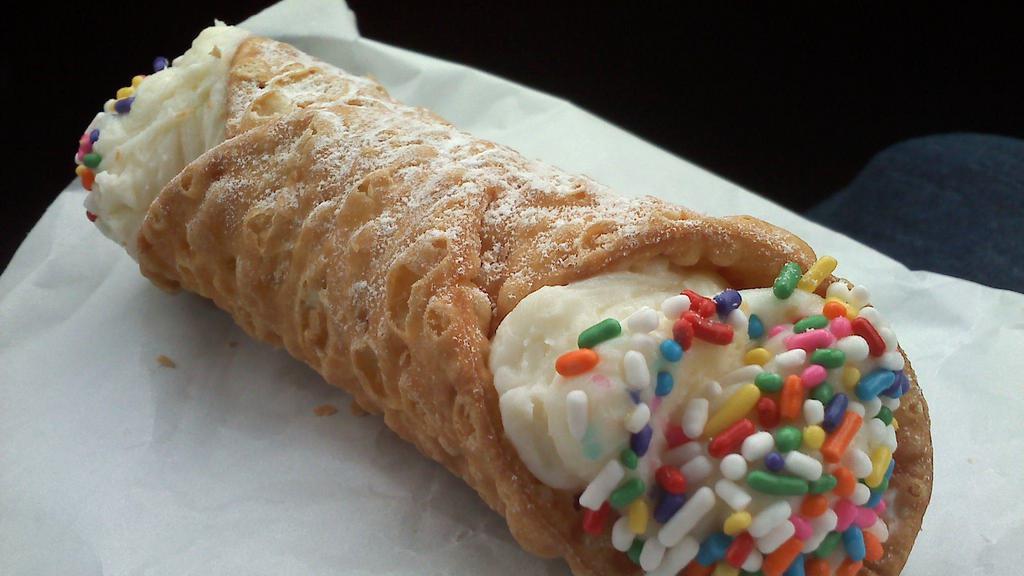 Cannoli · Italian pastry dipped in chocolate, sprinkles, and covered in powdered sugar (wow)