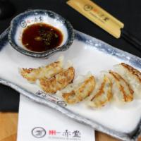 Gyoza (6 Pc) · Pan fried pork with veggie stuffing with house special sauce.
