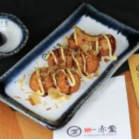 Takoyaki (6 Pcs) · Fried octopus dumpling, Japanese mayo tonkatsu, topped with bonito flakes.