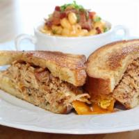 Hangover Sandwich · House chicken tinga, rosemary bacon syrup, bacon, house sauce, egg, cheddar cheese on brioch...
