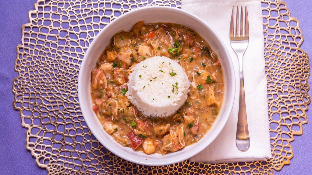 Creole Gumbo · gumbo includes chicken, shrimp, crab, turkey sausage, roma tomatoes and okra in homemade rue served over rice with bread and 2 sides