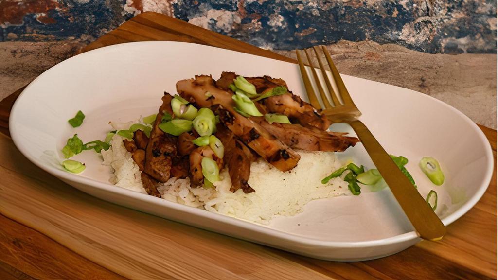 Basic Chick - Half Tray · Grilled Filipino bbq chicken over white rice, topped with green onions.